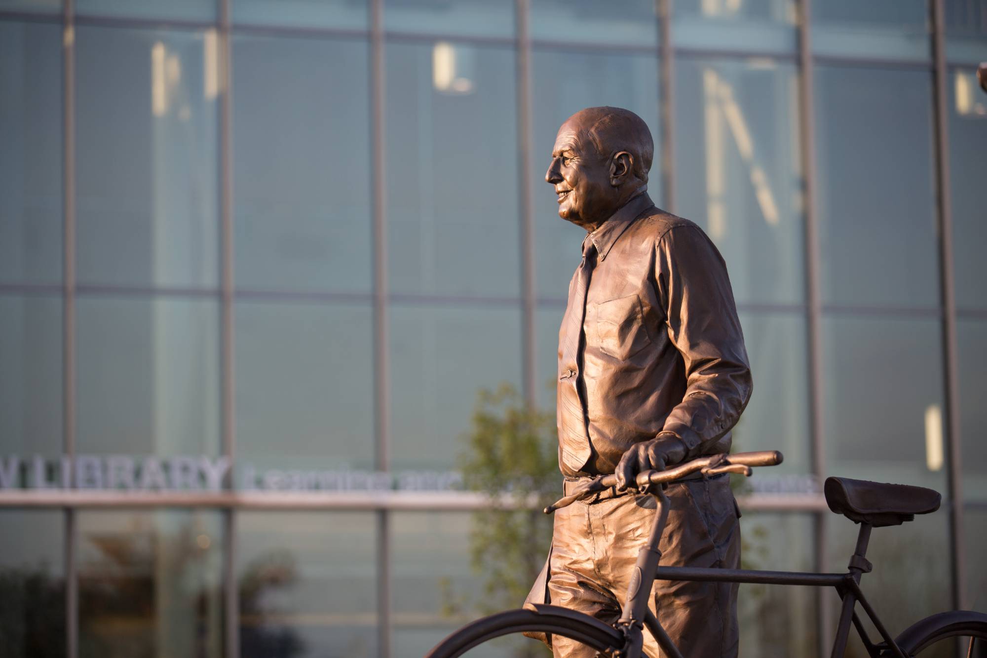 Statue of L. William Seidman with a bike
